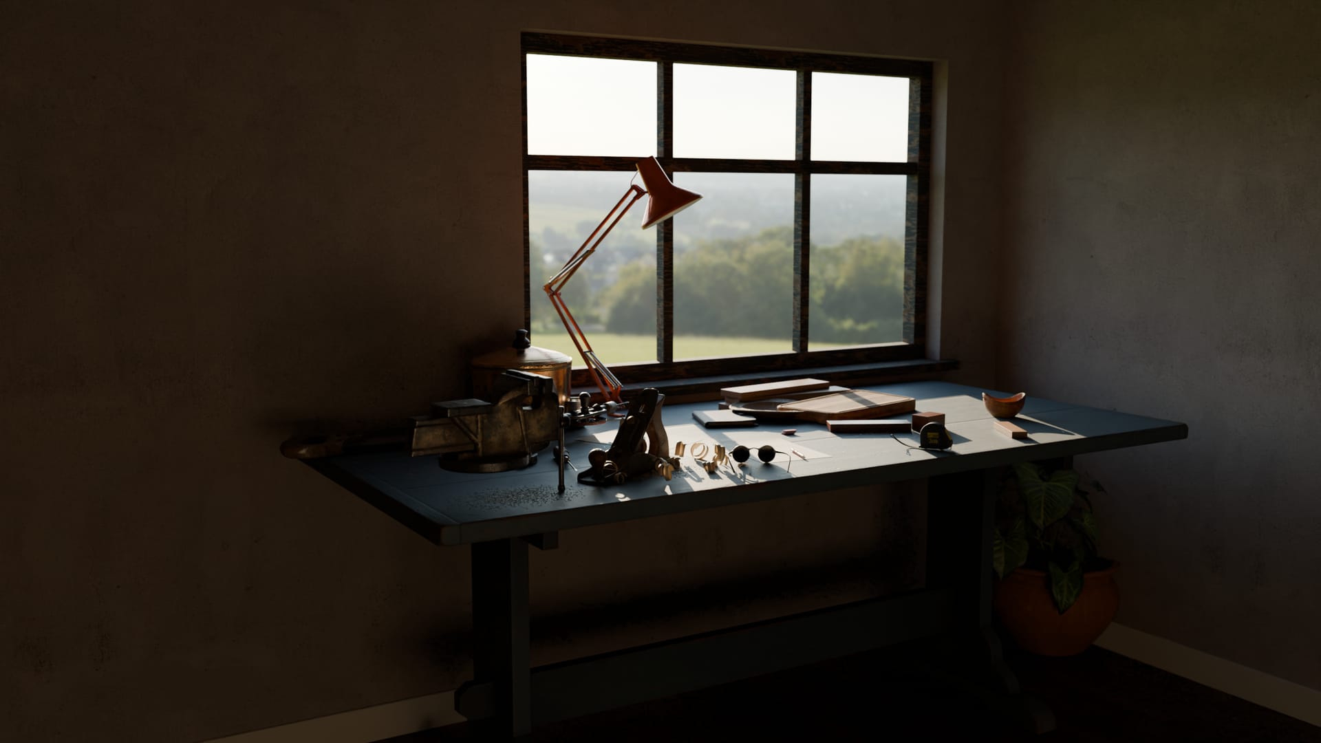 A workbench under a window in late afternoon light, with tools, papers and wood laid out, and green fields outside.