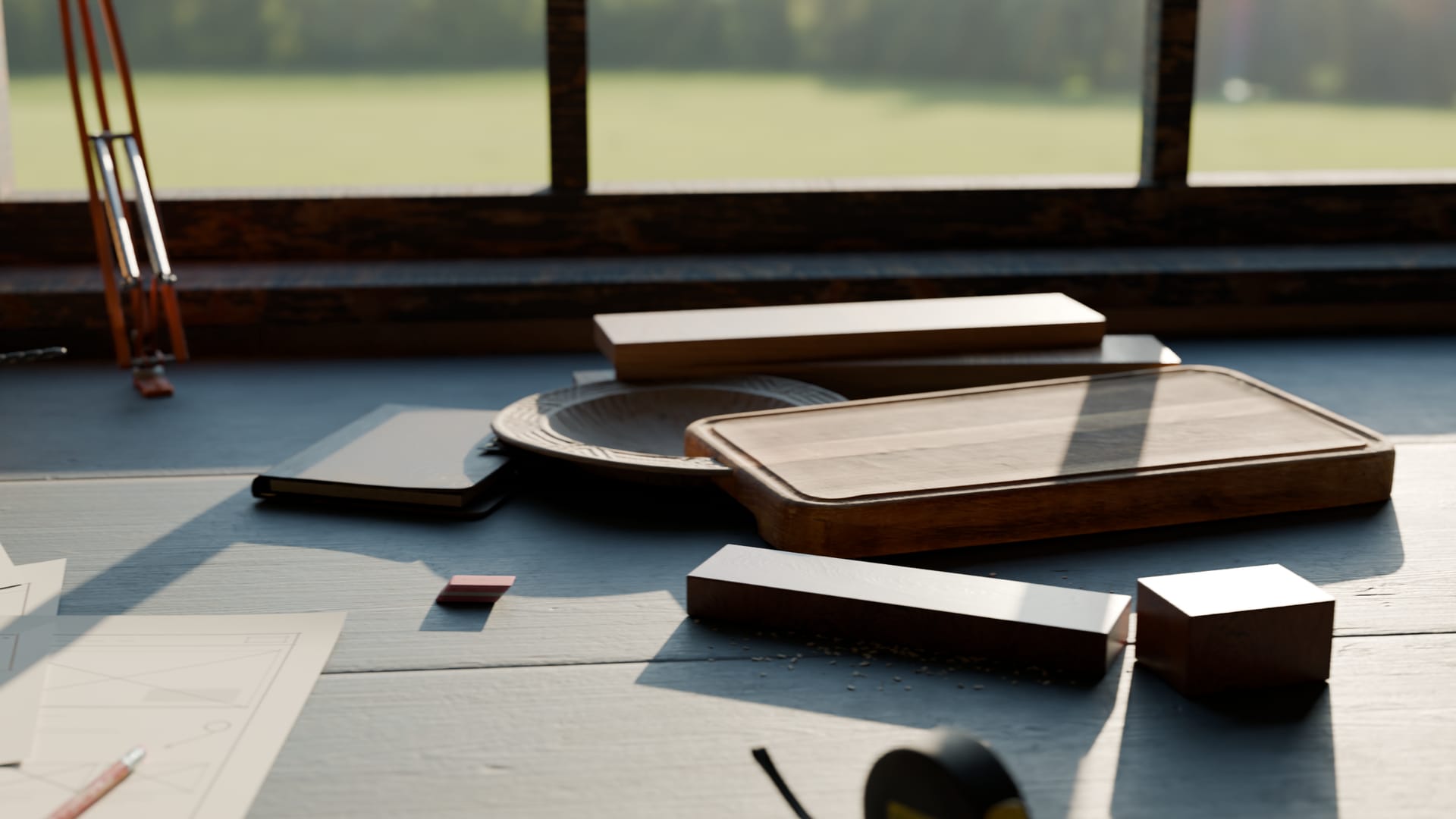 Offcuts of oak and rosewood beside a cutting board and a carved plate on the workbench.