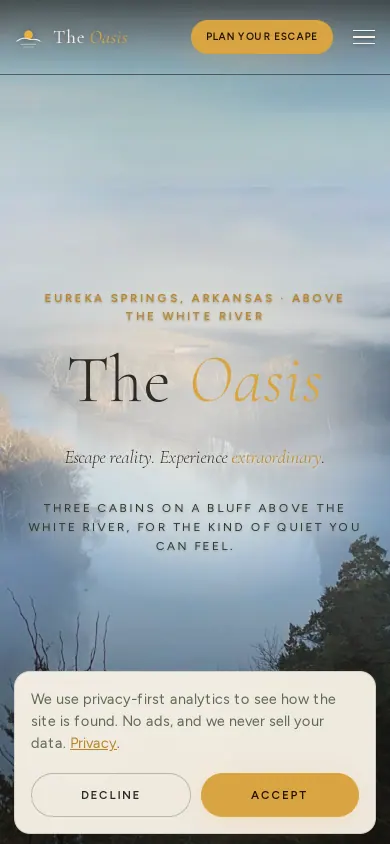 Home page of the The Oasis Cabins website on a phone